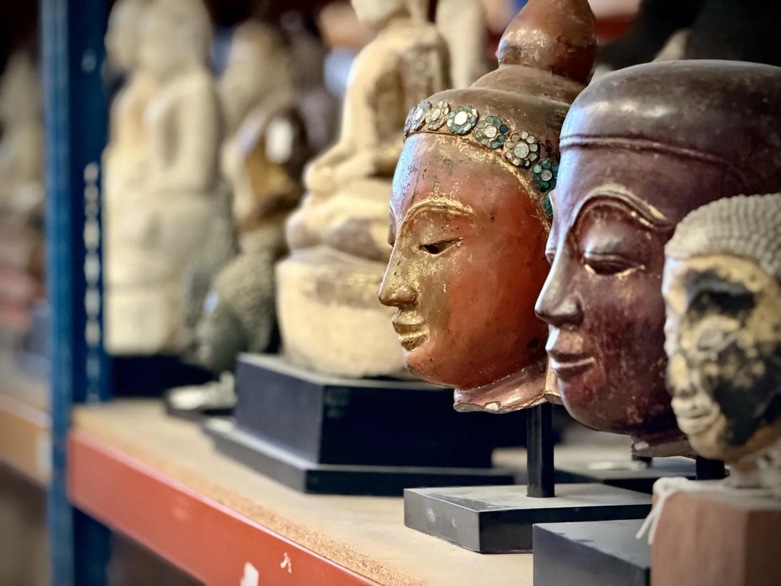 Gilded Buddha heads in profile