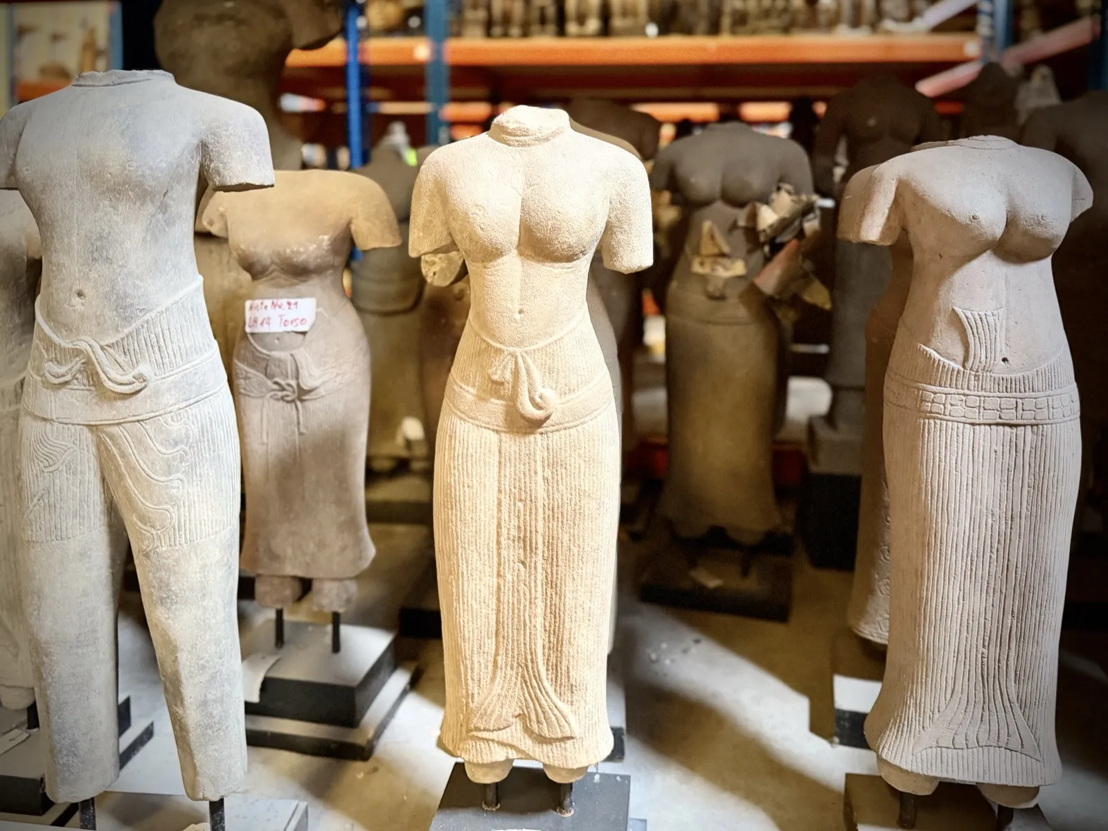 Khmer sandstone torsos from the Angkor period