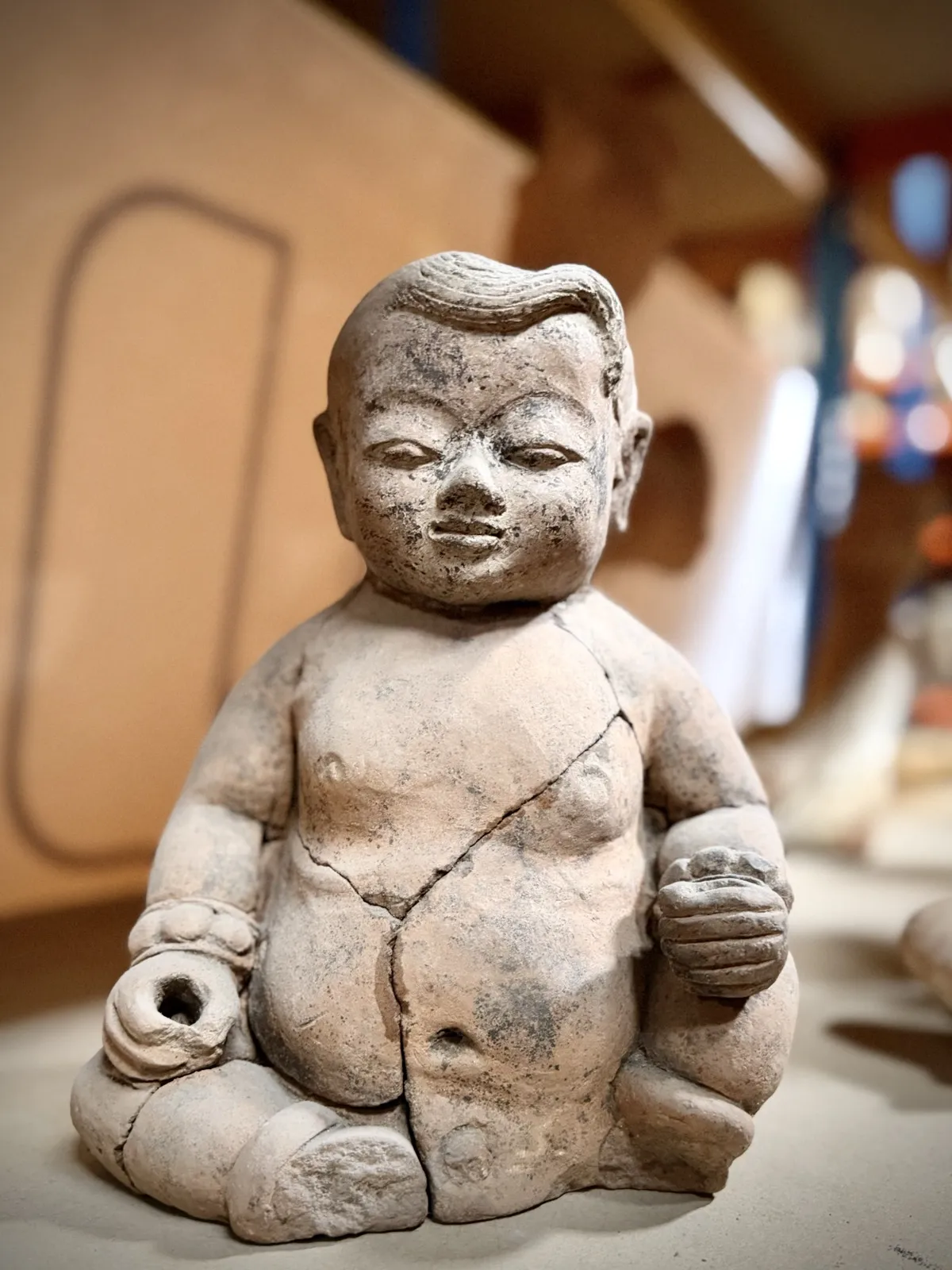 Seated terracotta tomb figure